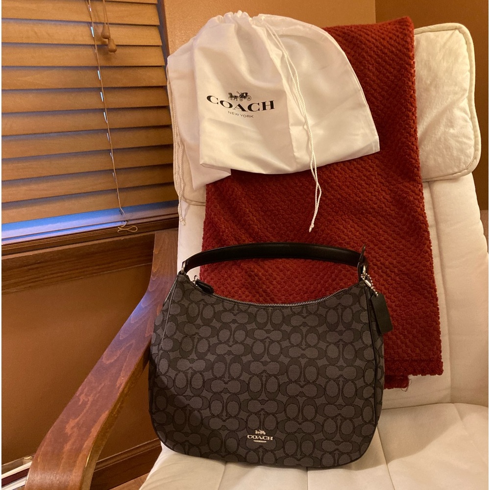 Authentic Coach bag, like new. Dust bag. Bag size is 12Lx9H, shoulder strap 8H.